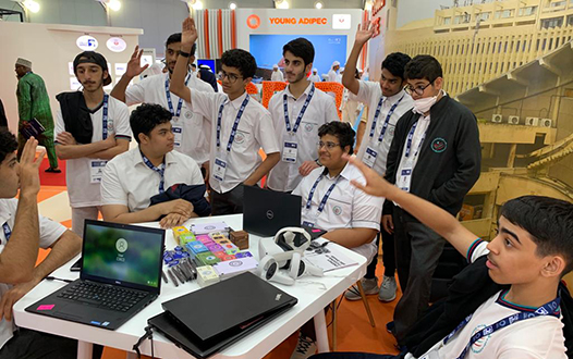 Students engaging at the IIT Delhi - Abu Dhabi coding zone during outreach event